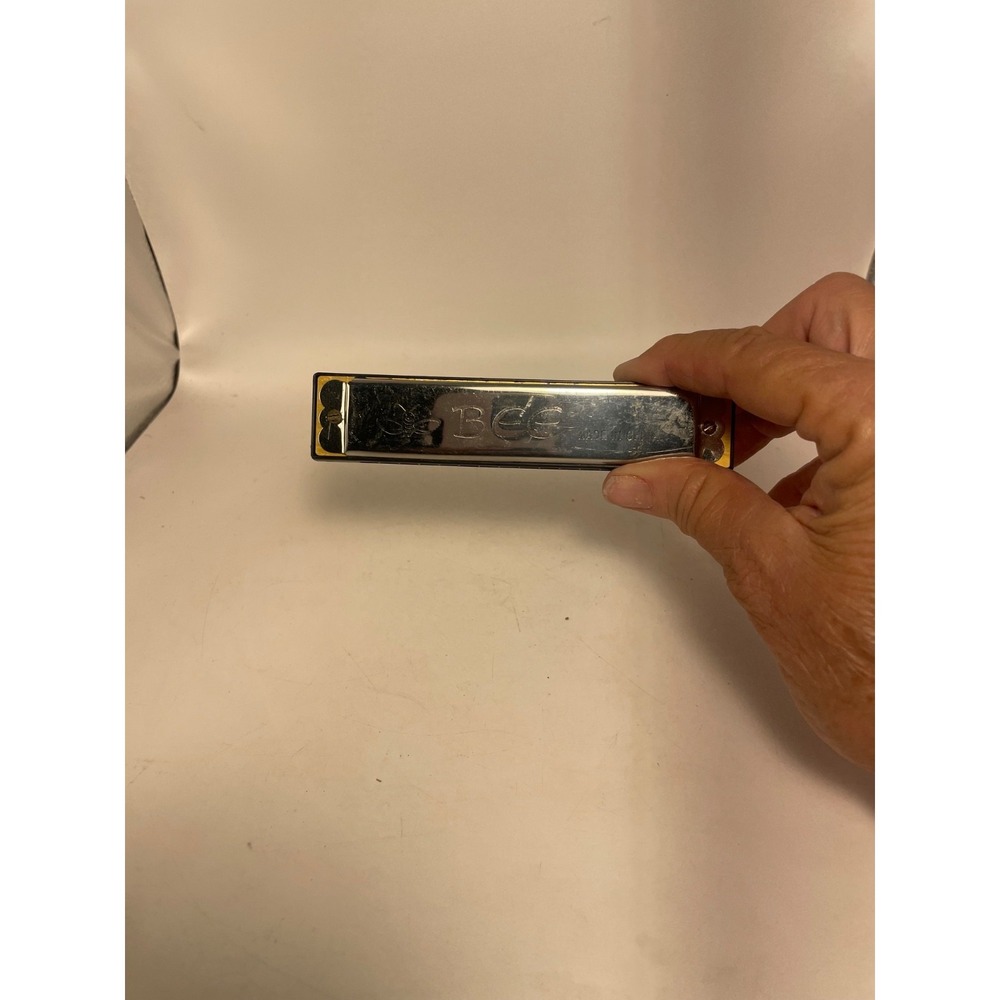 Harmonica  Made in China Key .Bee Made in China .Includes Case With  BEE
